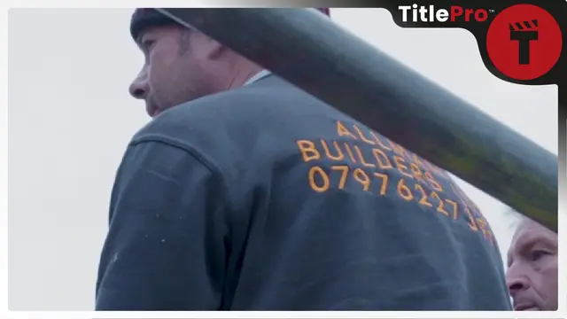 Builder in grey shirt with company details printed on the back
