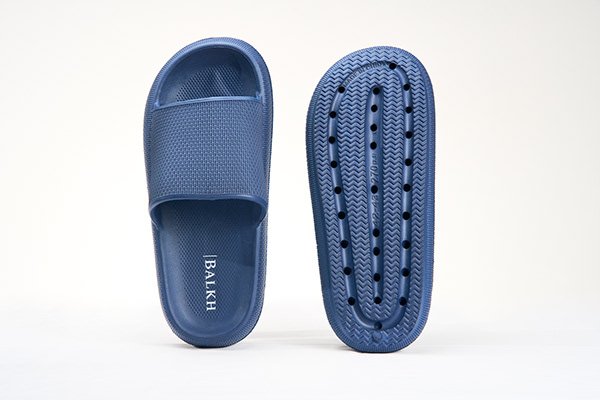 Blue textured slide sandal with top and sole views