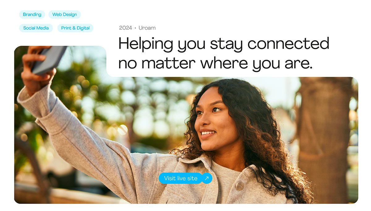 Woman taking a selfie outdoors with bright sunlight behind her.