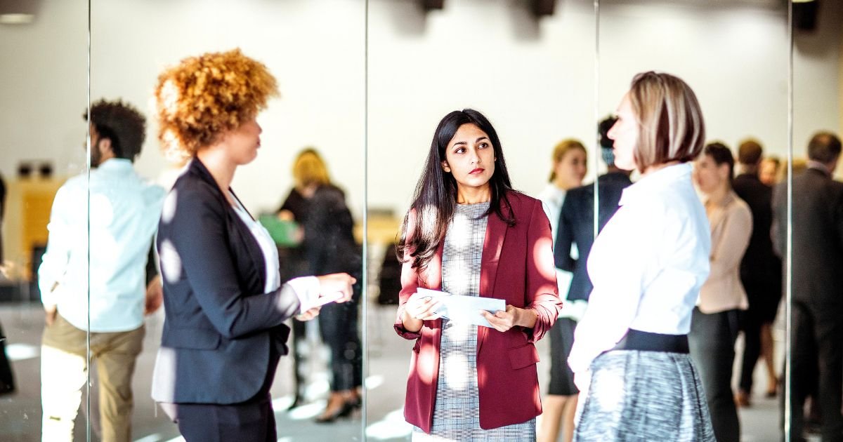 Professionals networking at a corporate event during a business conference