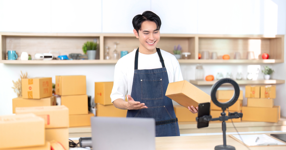 E-commerce seller doing a DIY product shoot using a ring light and camera