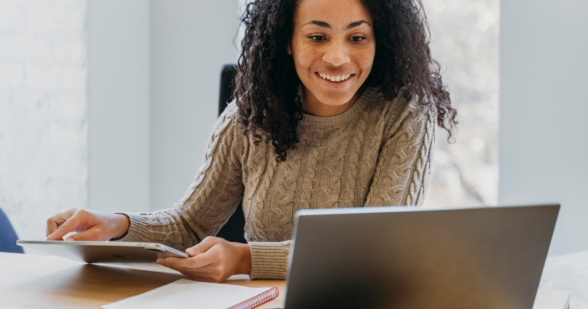 Marketing professional reviewing performance data on laptop to optimize creative campaigns by Title Productions.