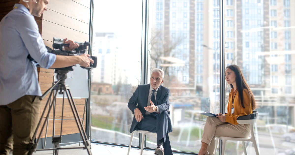 Corporate interview filming session showing professional video production setup for business storytelling