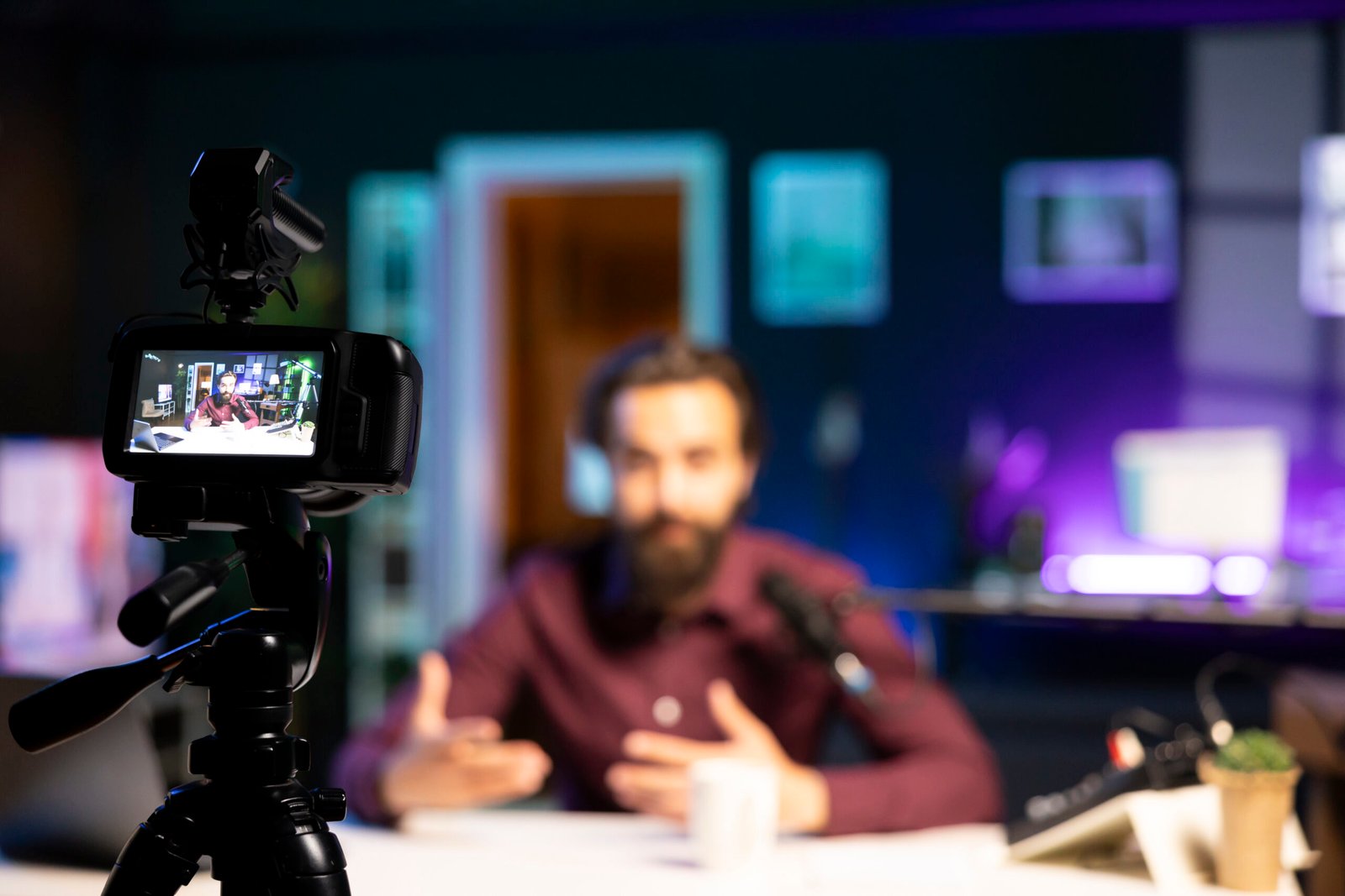 Camera recording a content creator in studio during professional video production session by Title Productions.